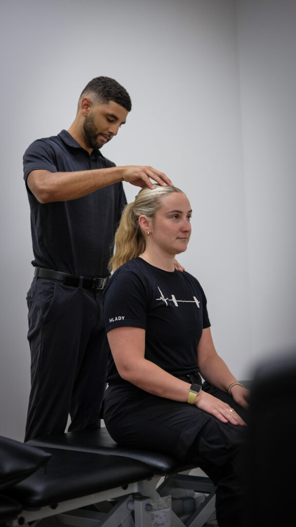 Dr Aden working with a patient