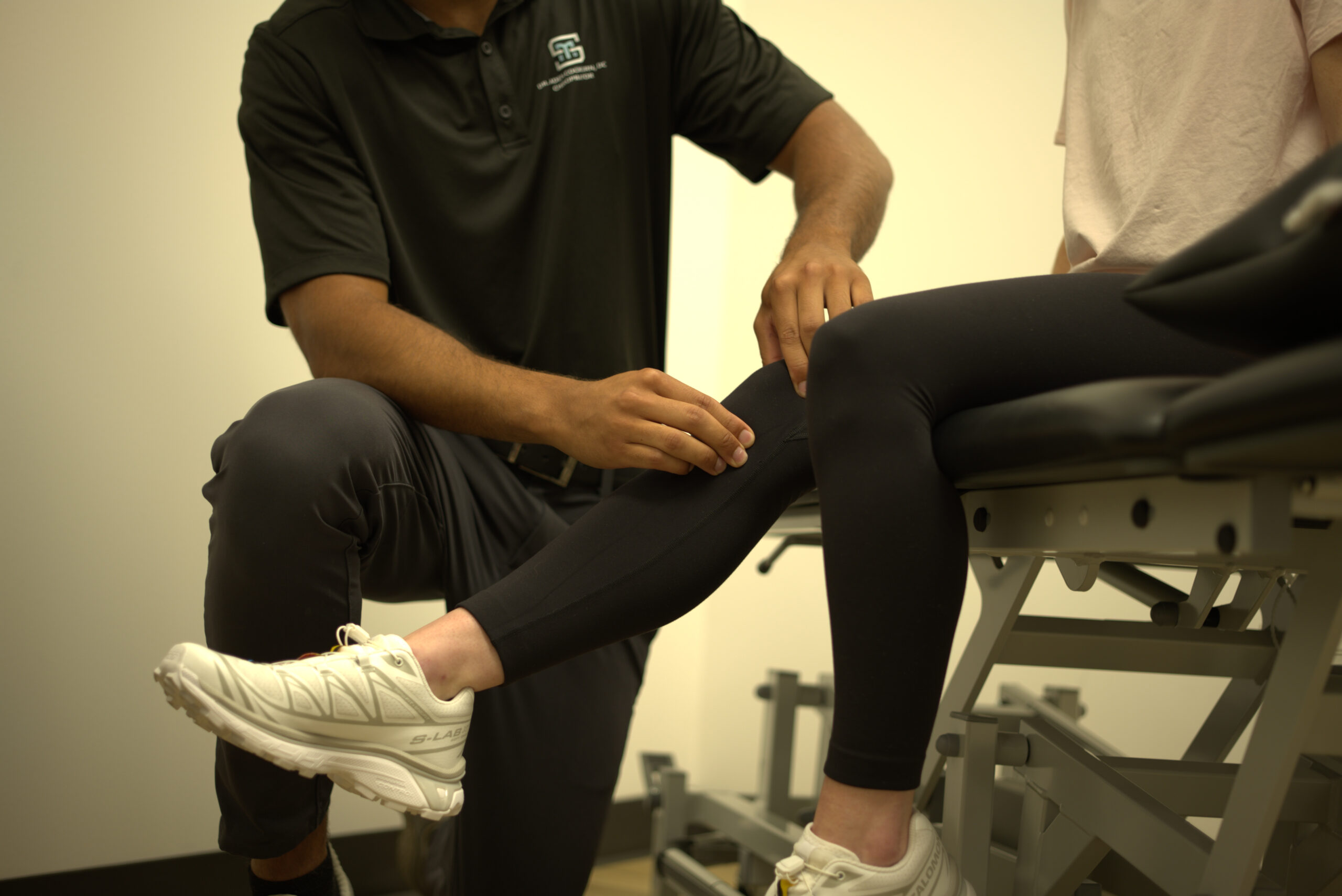 Dr Aden caring for a patient's knee