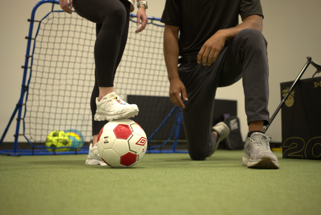 Dr Aden working with an athlete