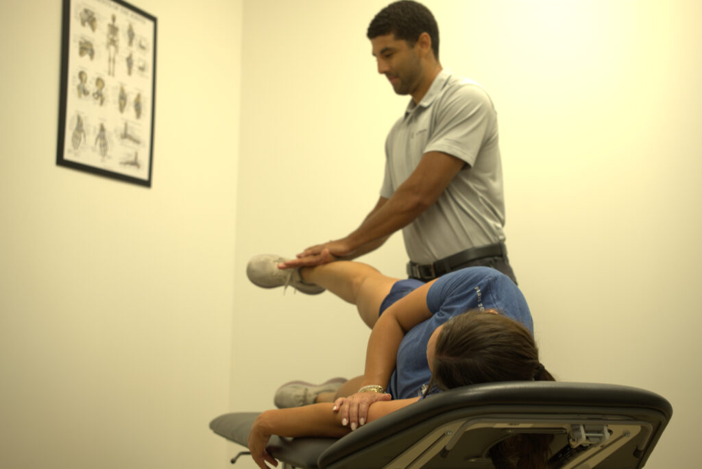 Dr Aden Cockburn treating a patient with sciatica